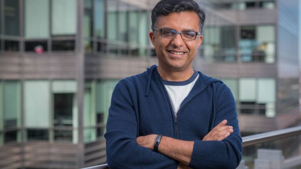 CEO Anil poses with folded arms