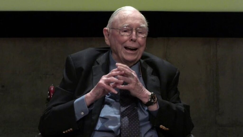 Charlie Munger situated at a public discussion