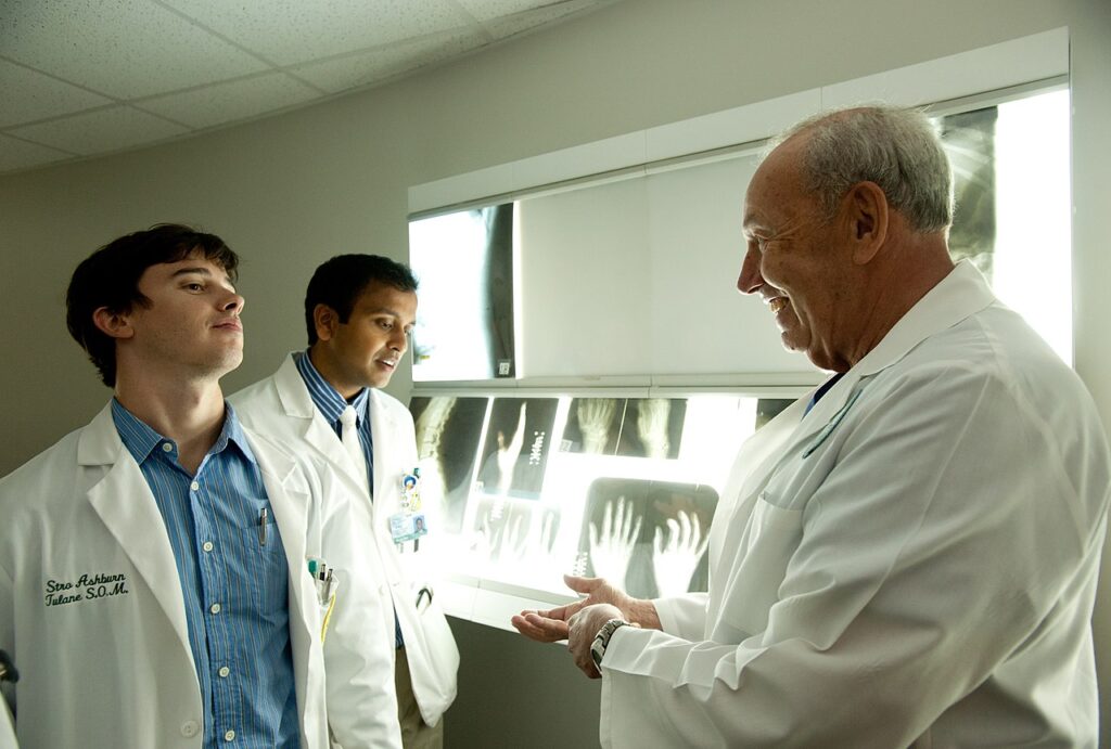 An instructor teaching medical students about radiography