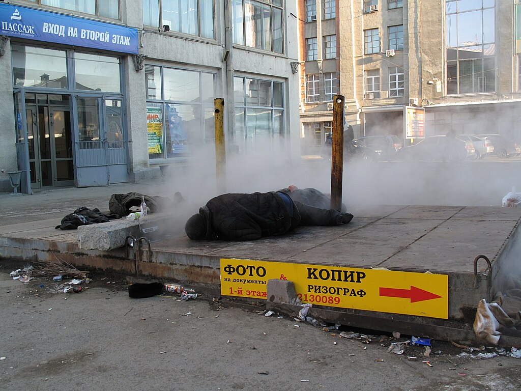 Homeless people sleeping in the open during freezing temperatures