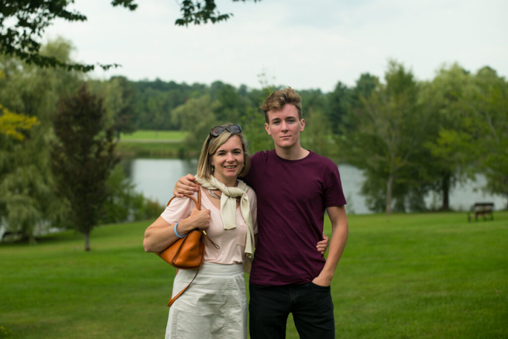 Mother and son with a lake in the background