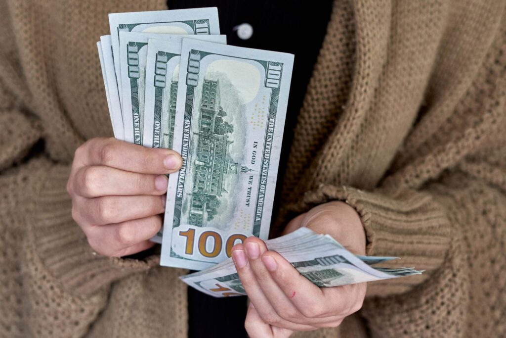 Close-up of a woman counting money