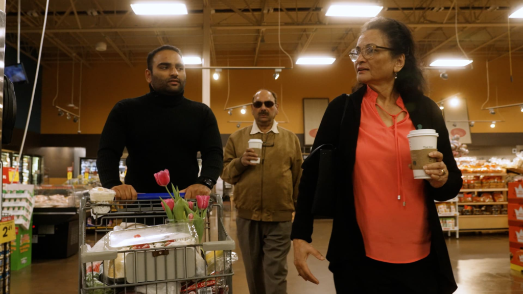 Khan and his parents shopping at CostCo 
