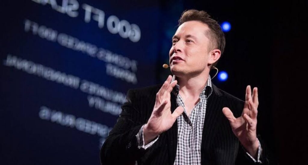 Musk speaking at a conference