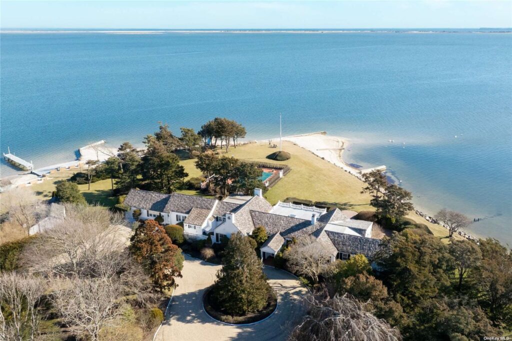 Aerial view of the deep dock, house, and beachfront