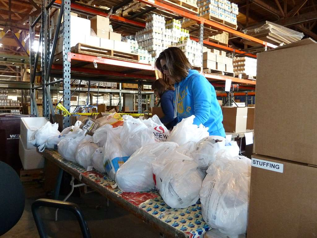 Arranging food packs for Thanksgiving