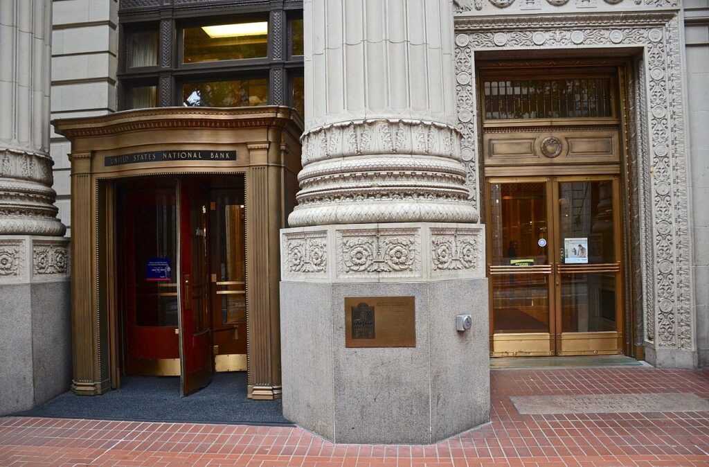 The doors leading into a mortar and brick bank