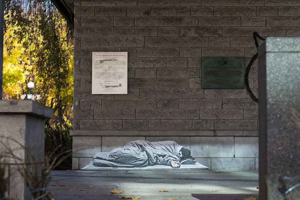 Graffiti representing a homeless on the place of the University of Quebec