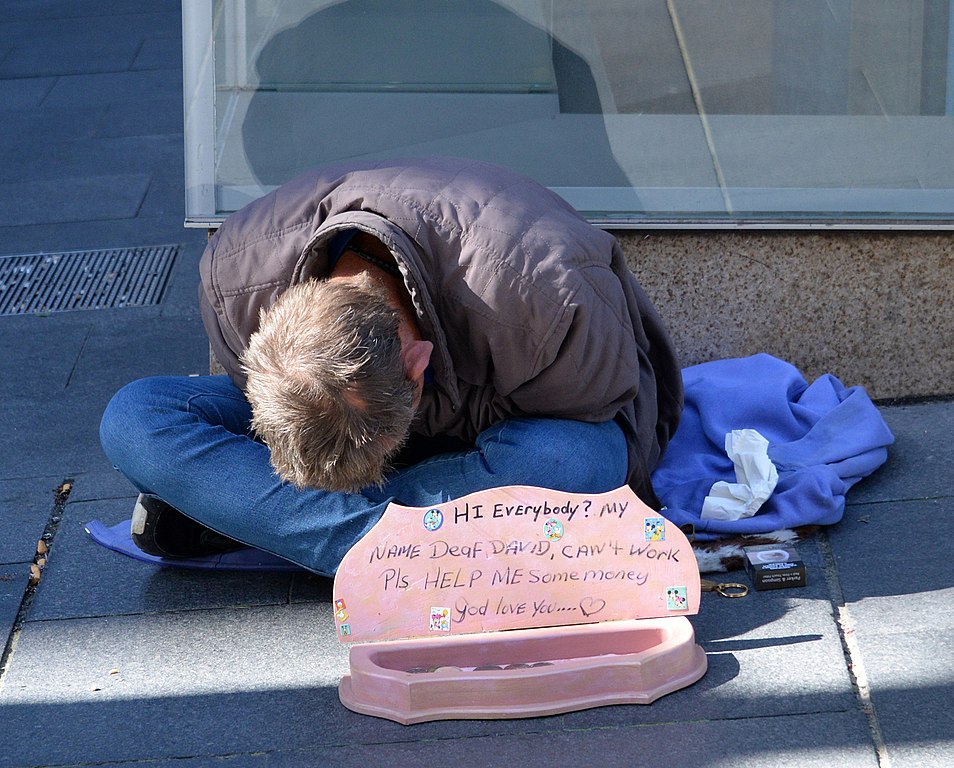 Homeless man asking for help in Sydney 
