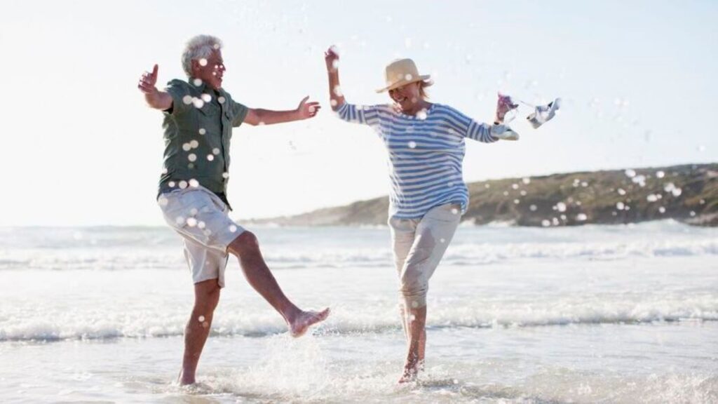 Happy senior couple at the beach