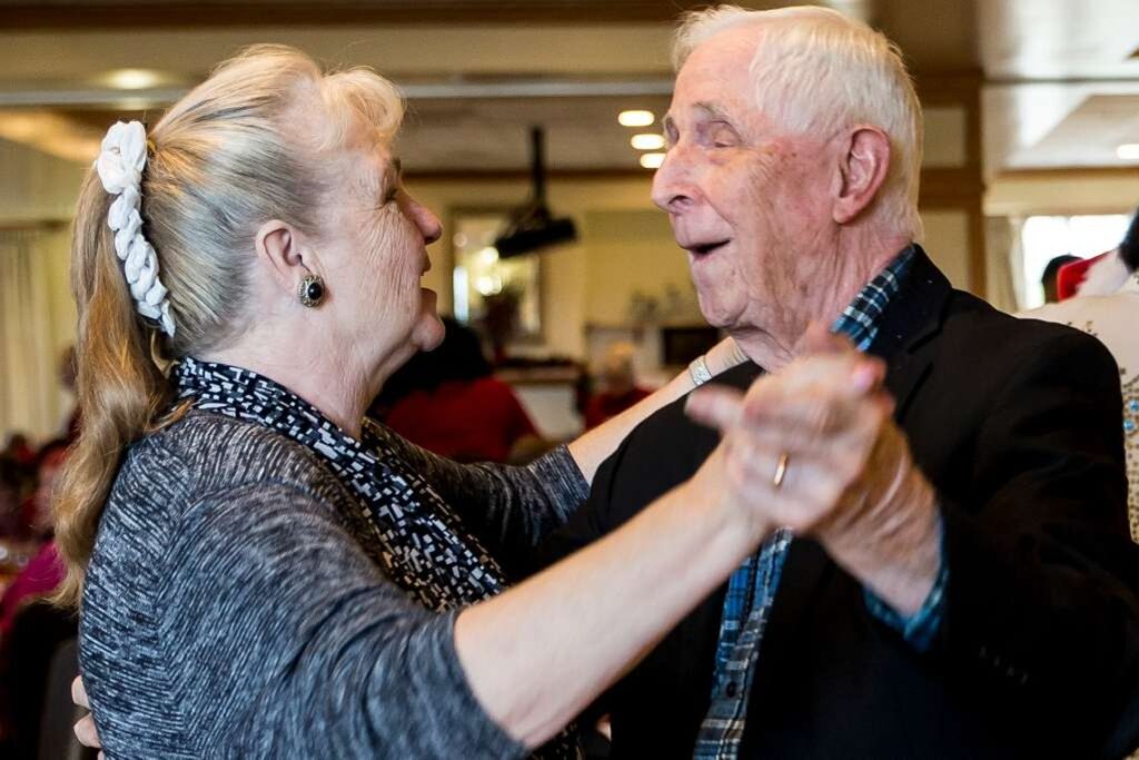 Two senior citizens dancing