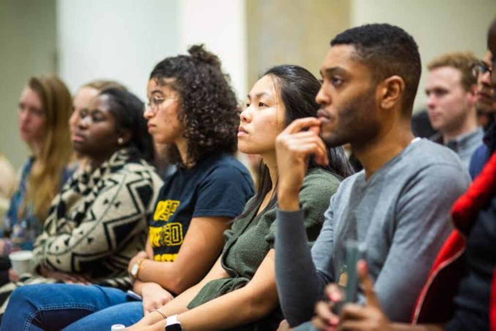 A cross-section of students listening to a lecture