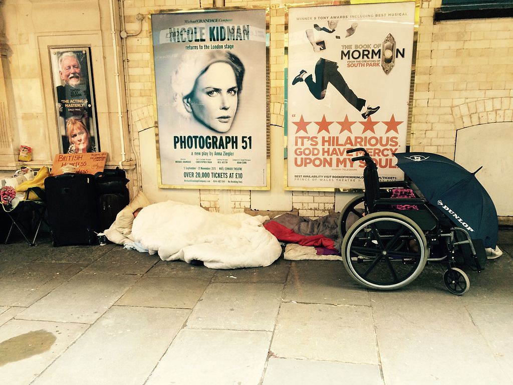 Person asleep outside theatre