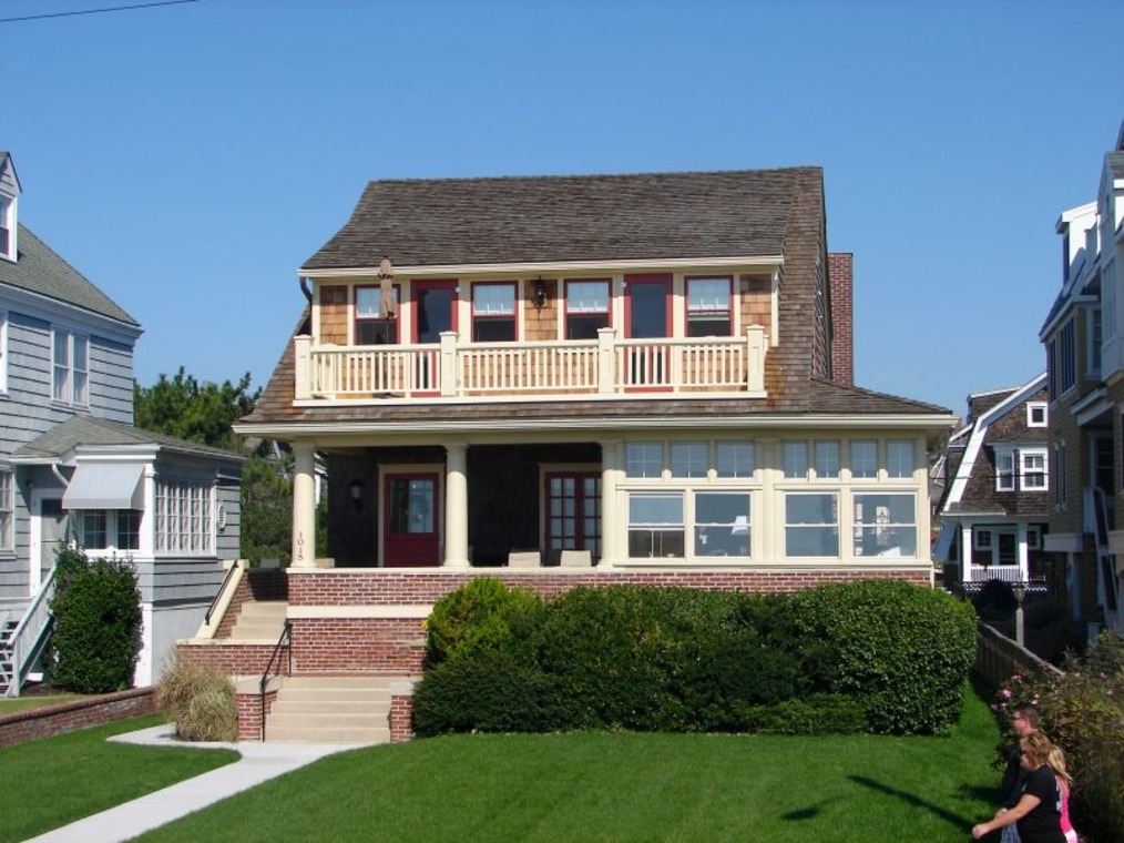 A residential building with lawn out front