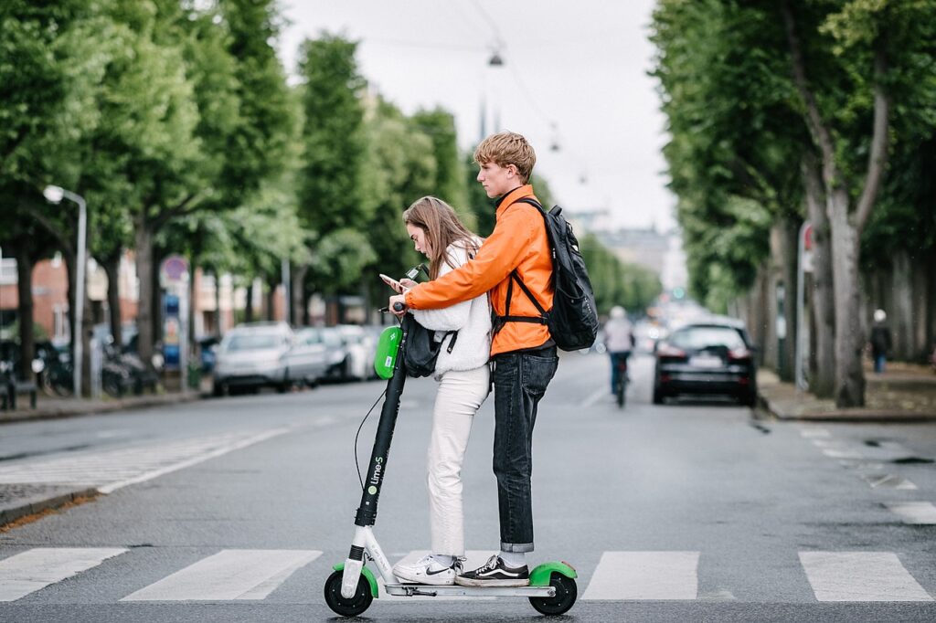 Generation Z kids on electric scooter