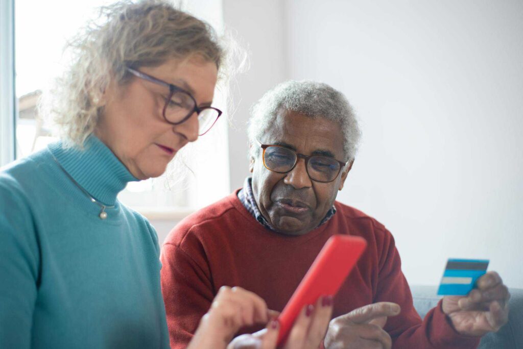 Senior couple with credit card
