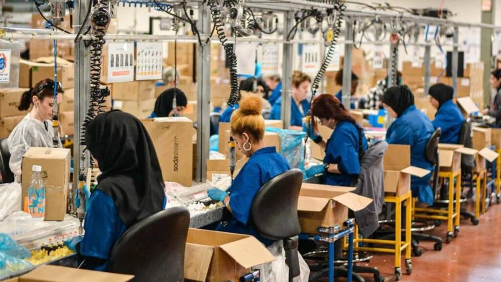 People working on a manufacturing line