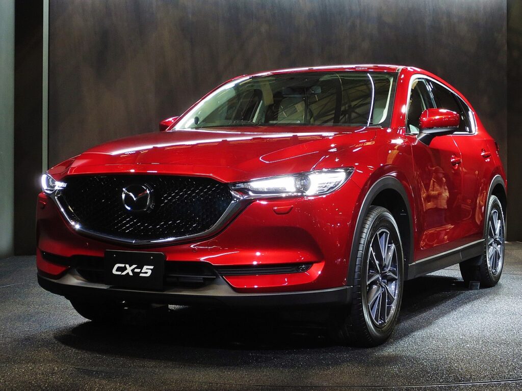 A red Mazda CX-5 at an auto show