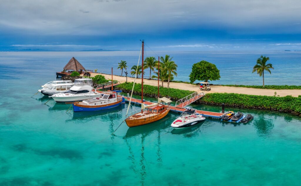 Cruise boats on beautiful beaches of Fiji Islands