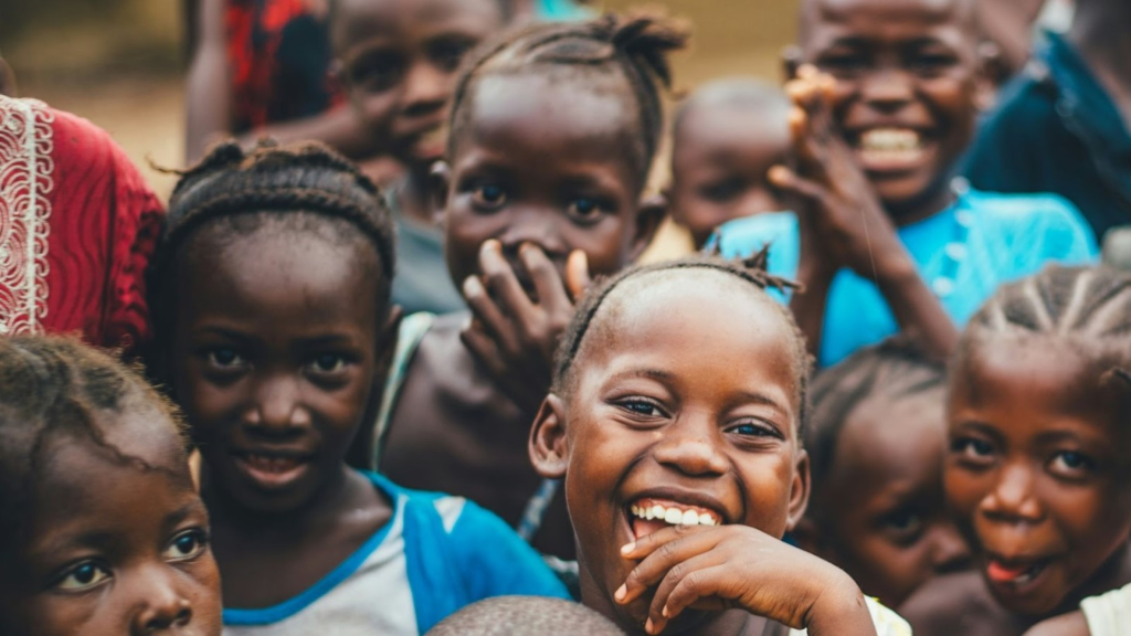 Children smiling happily at the camera