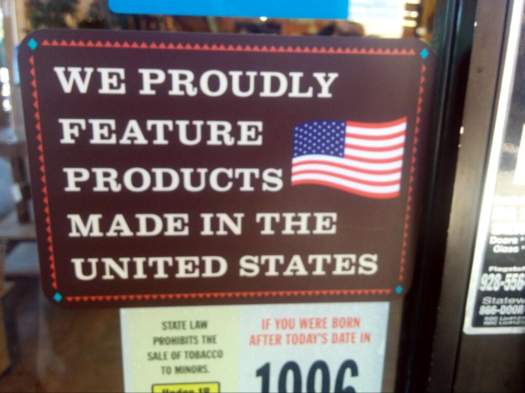 A store sign indicating that they stock locally manufactured products