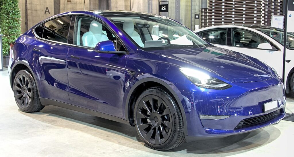 A blue Tesla Model Y at the Zuerich 2021 auto show