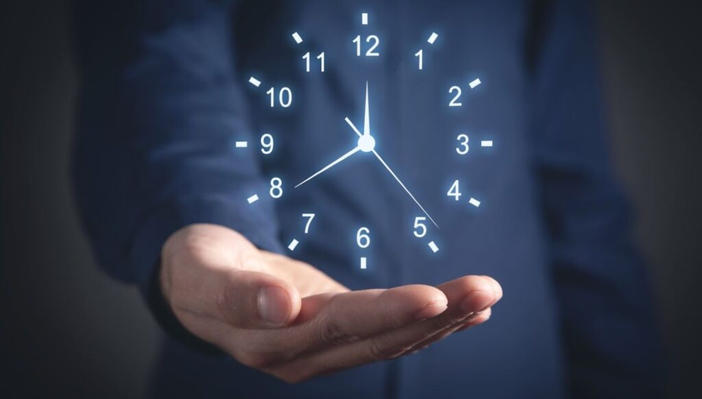 A man cupping a holographic clock in his hand