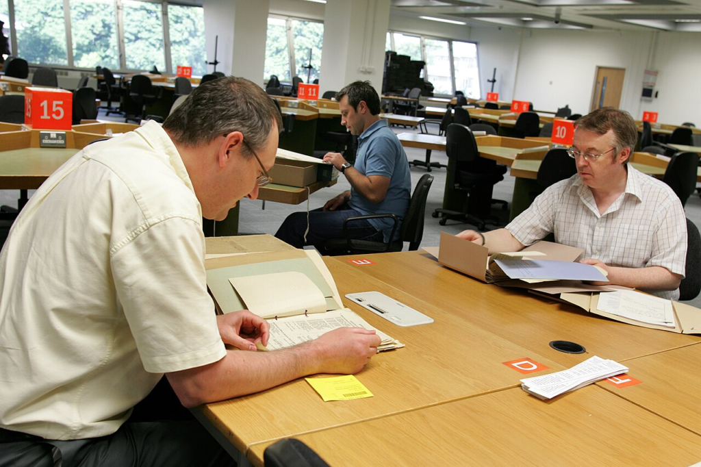 Researchers with documents in the open reading room