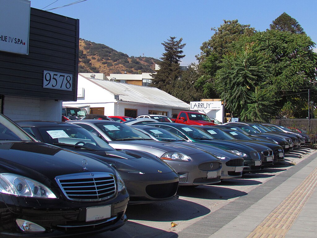 A row of used cars at a dealership