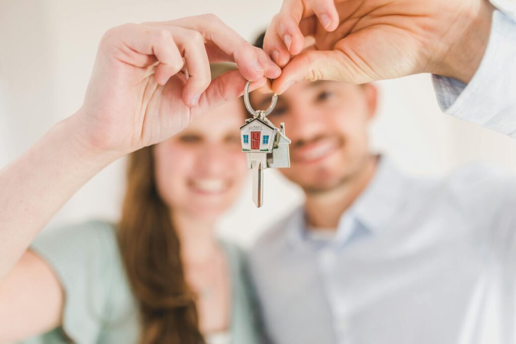 Happy couple holding their house key