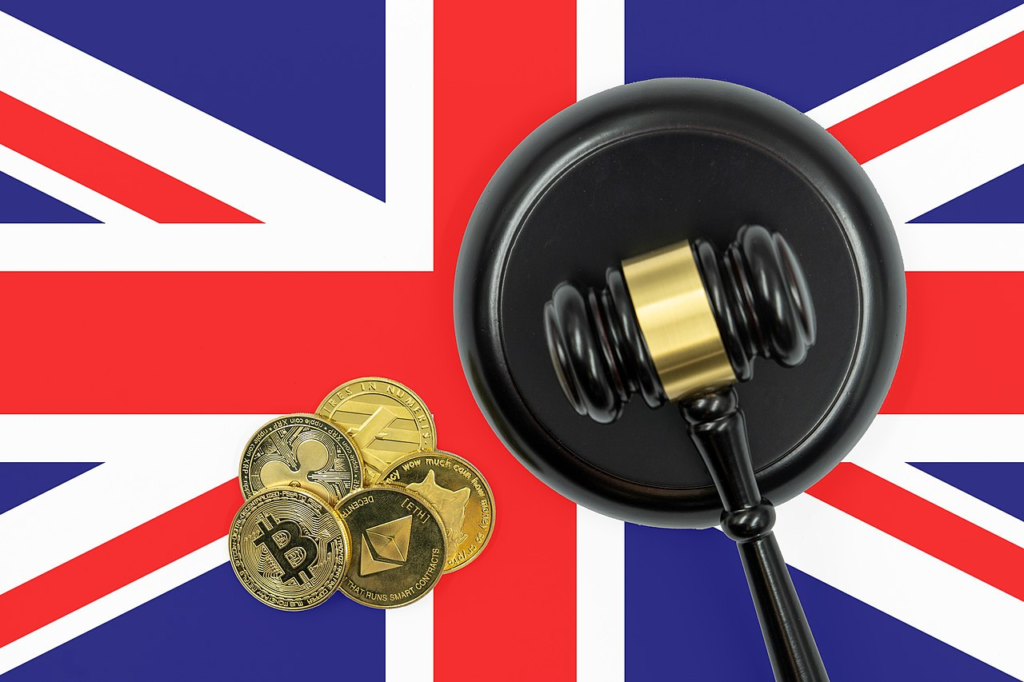 Medallion of digital currencies and a gavel on the UK flag