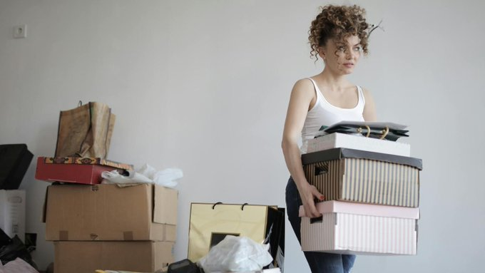 A young lady parking boxes of her belongings