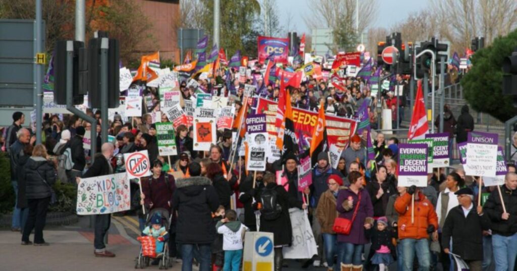 Crowd of workers protesting in the UK