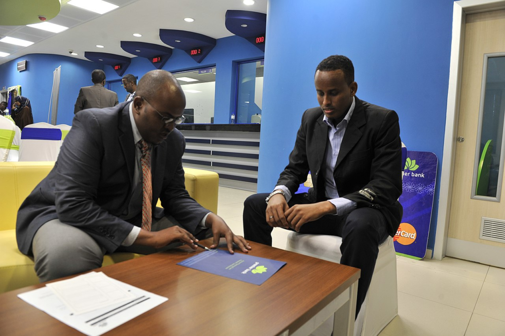 A bank staff attending to a customer