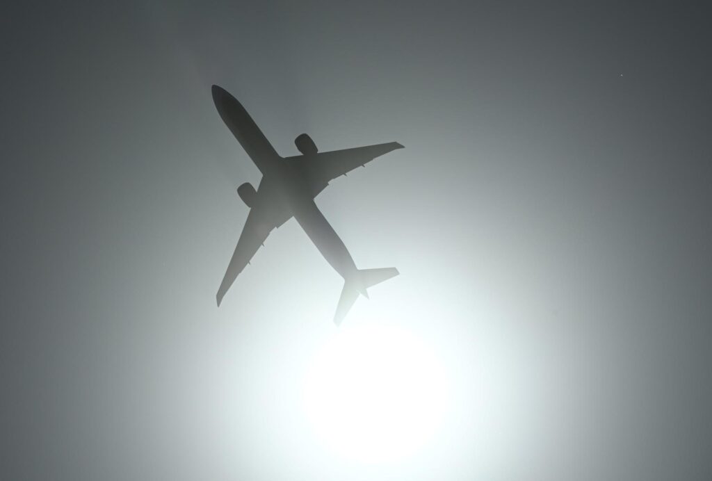 Shot of a jetliner and the shining sun