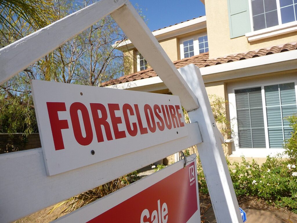 Foreclosure sign in front of a house