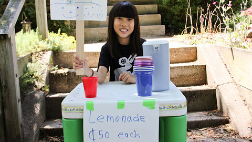 Young girl selling lemonade