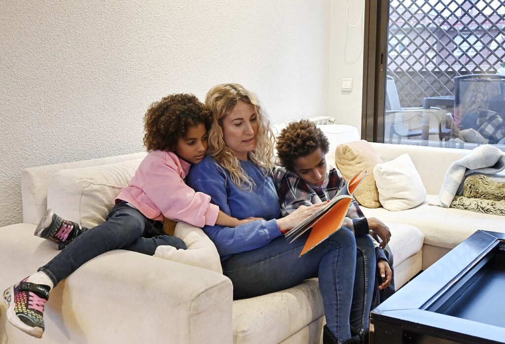 A single mother reading to her kids