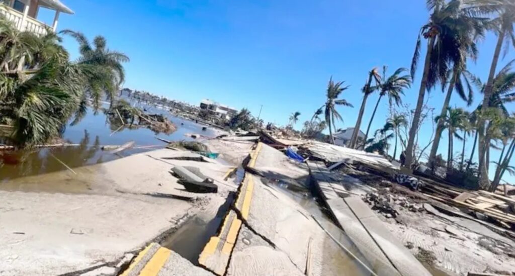 A coastal road damaged after a storm