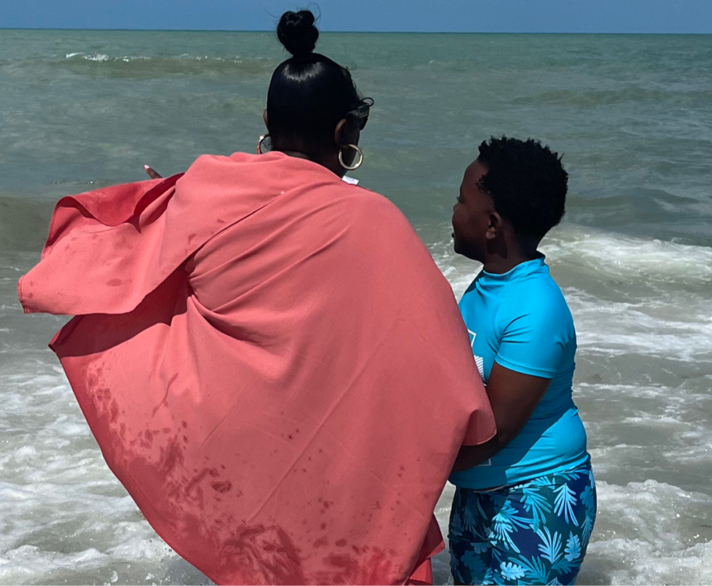 Kennedy at the beach with her son