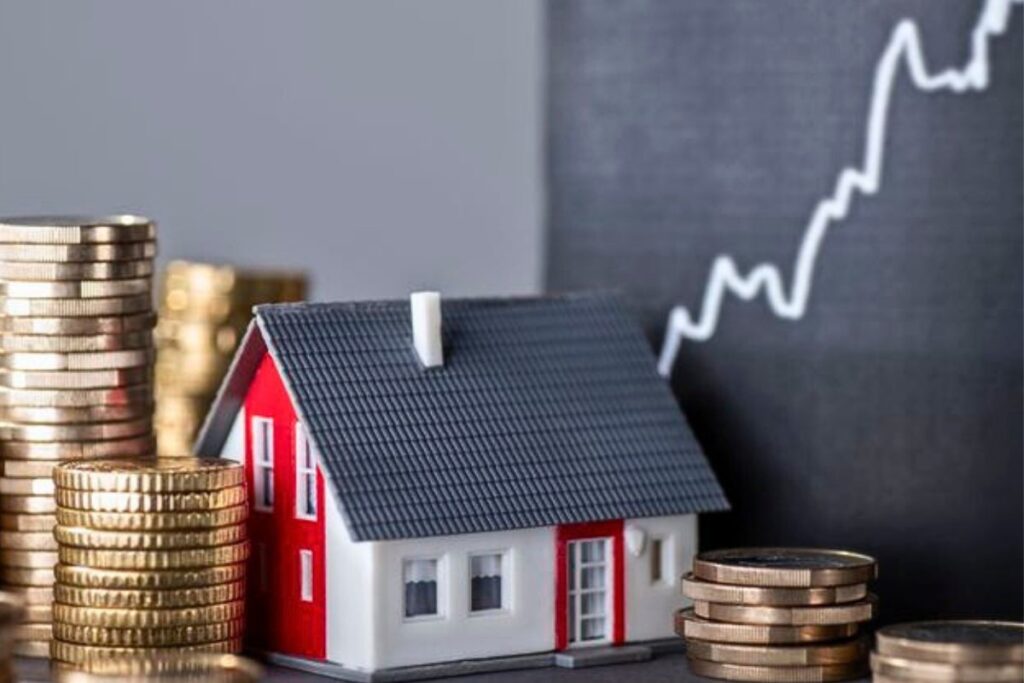 A house demo with stack of coins on the side