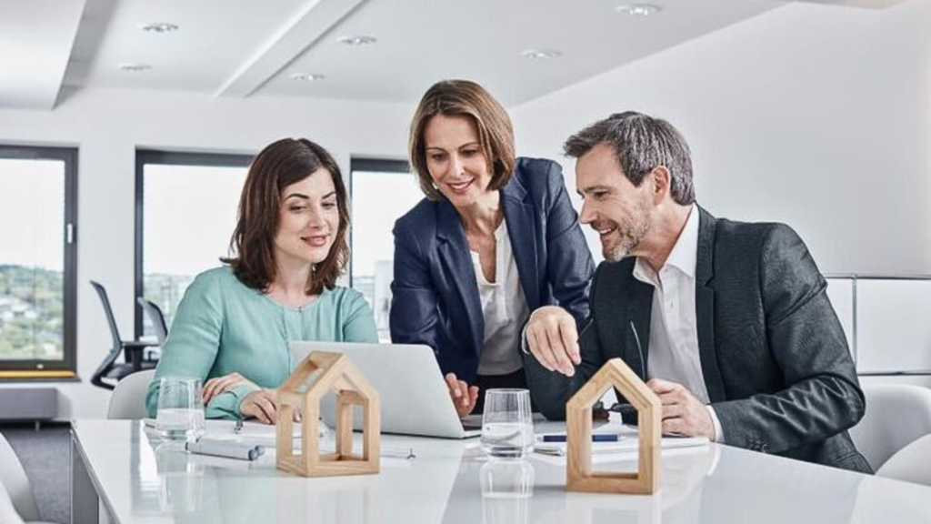 Workers using laptop working in office