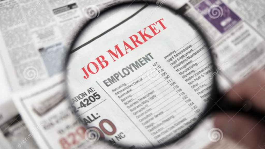 Magnifier over a newspaper showing "JOB MARKET"