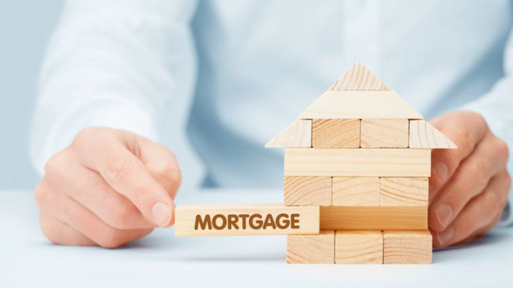 Stack of house bricks with MORTGAGE written on one