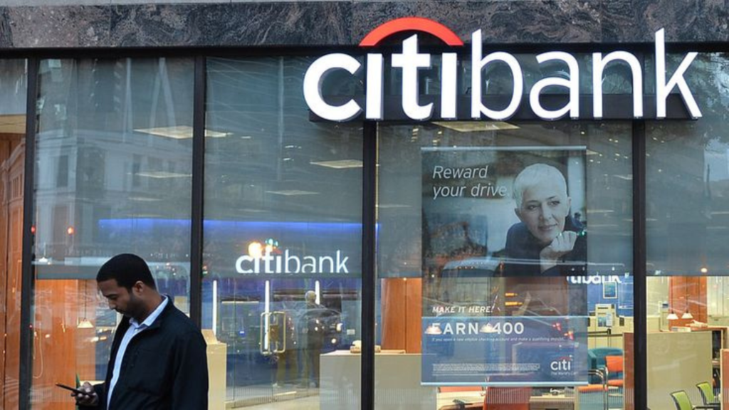 A man standing in front of Citi Bank