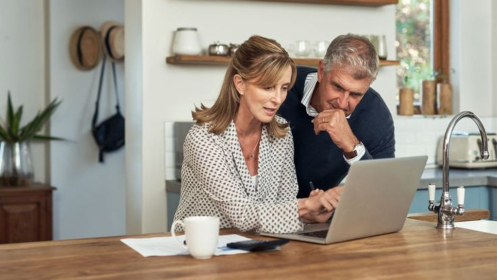 Couple looking at a laptop screen