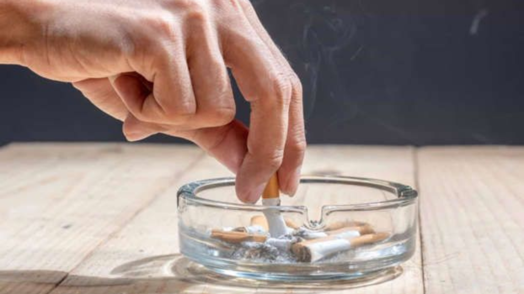 Pressing a cigarette on ashtray