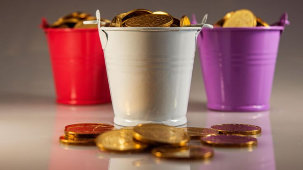 Three buckets filled with gold coins