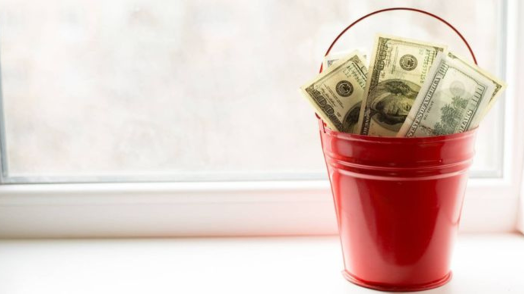 A red bucket of cash