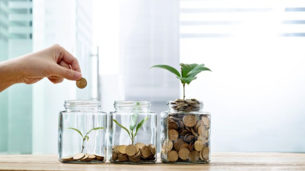 Three jars of coins being filled